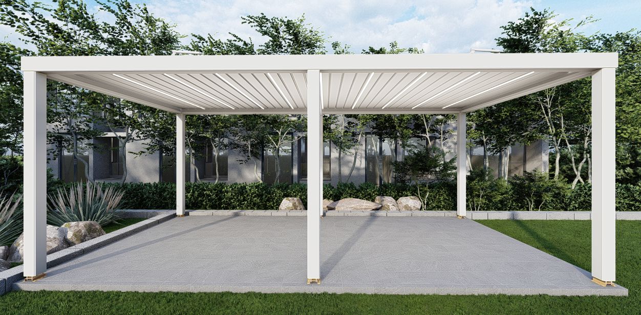 White aluminium louvered pergola with LED-lit adjustable roof over a paved garden terrace