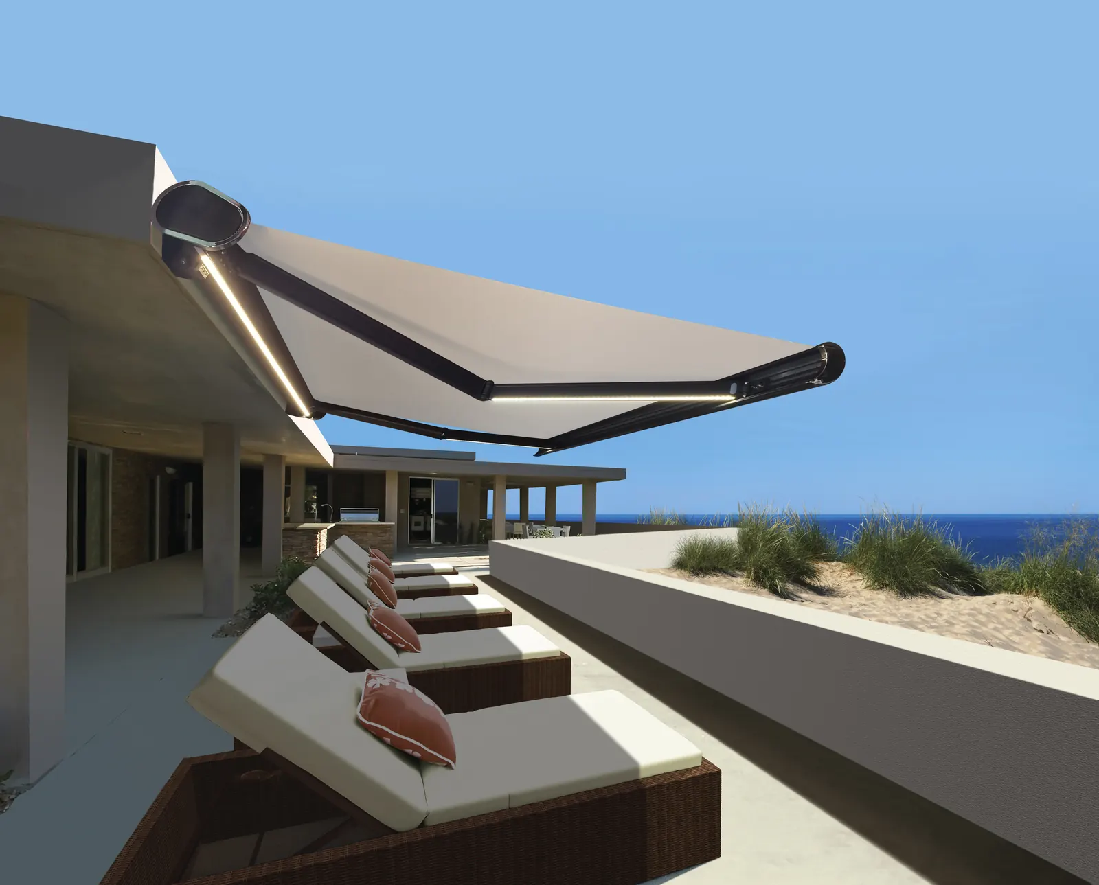 Motorised retractable awning with LED lighting over a terrace